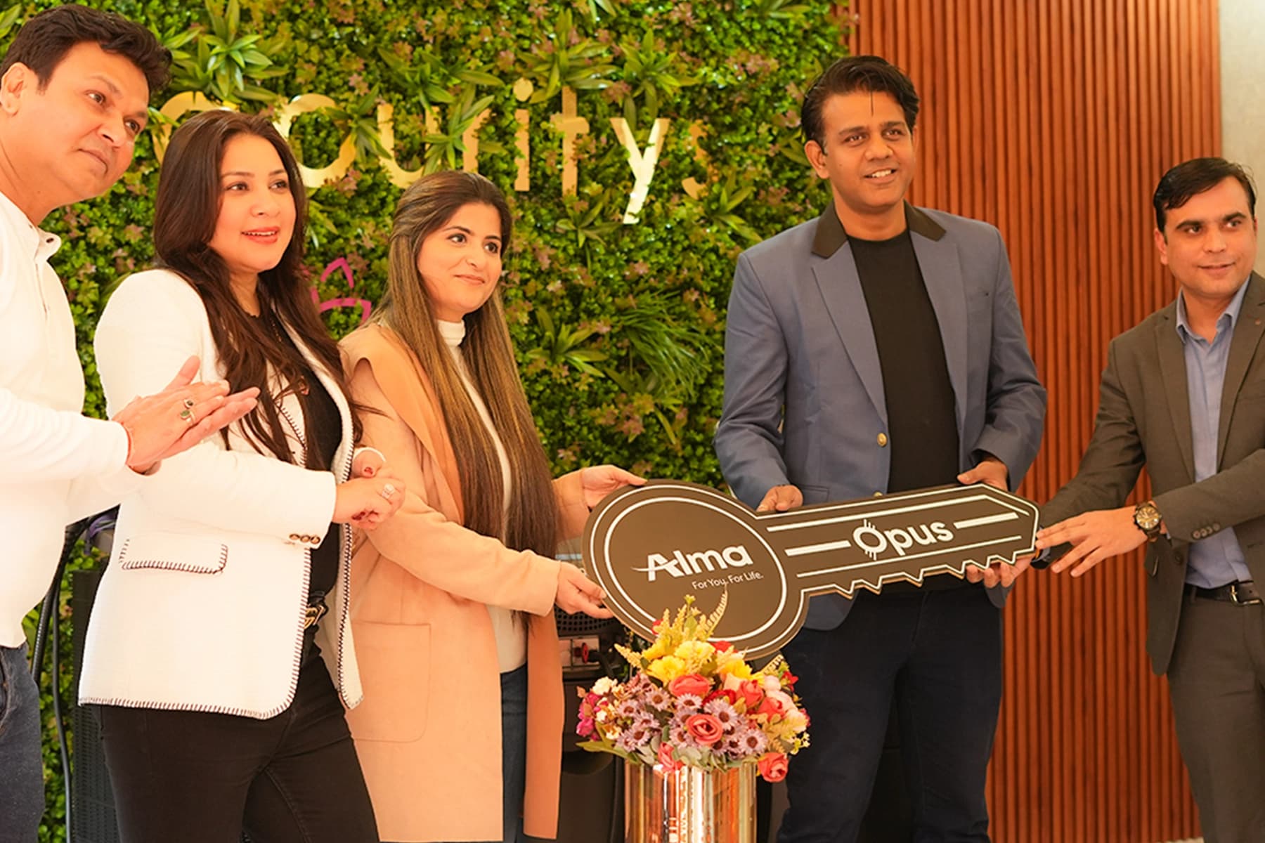 Dermapuritys staff team celebration with flowers and cake